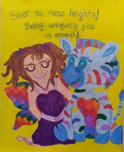 A young woman with pigtails wears a purple dress and fairy-like wings that are made out of rainbow color puzzle pieces. She sits next to a blue zebra with rainbow color strips. Above them it says 